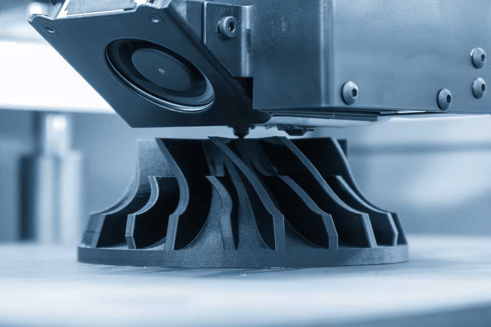 FDM 3D printer producing a functional carbon-fiber filament part