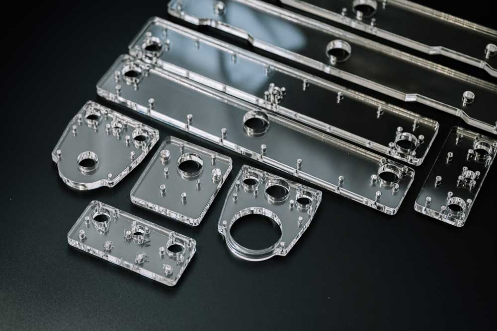 Laser cutting acrylic and plywood sheet stock on a CO2 laser cutter